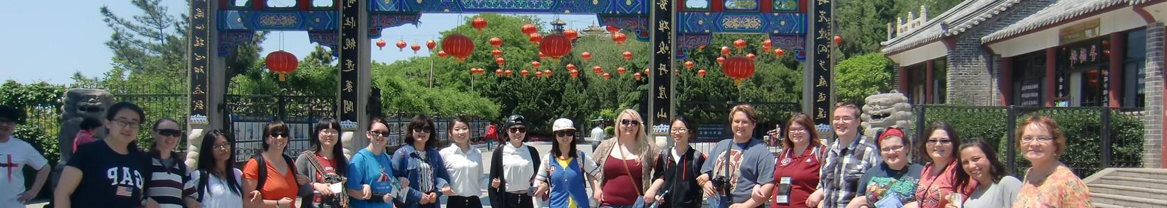 Study abroad students in front of architecture in China.